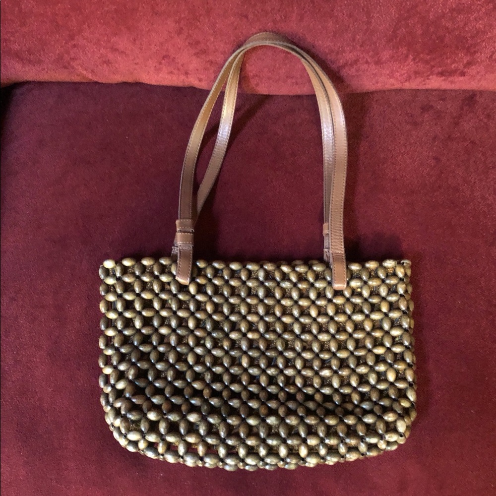 EUC. The Sak, wood bead bag with leather straps.
